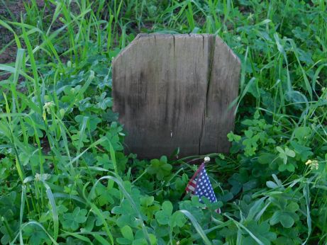 [Picture of weathered wood grave marker]